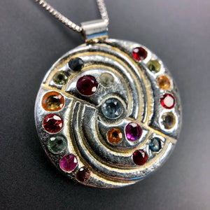 Multi-color sapphires, ruby, and spinel swirl necklace