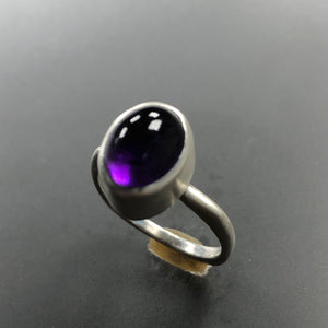 Amethyst and sterling siver.  Size 6.75