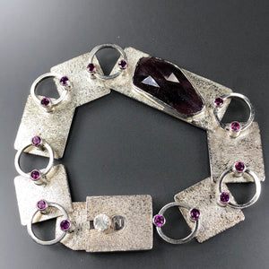 Deep red ruby with garnets; bracelet in sterling silver with box clasp