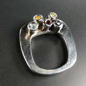 Fine silver ring with multi-colored gemstones.  Size approx. 6.5-7