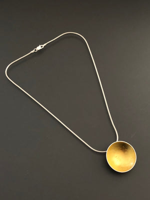 Single golden orb necklace