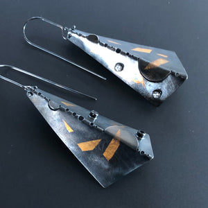 Triangular earrings in 23.5 K gold, sterling silver, and white topaz